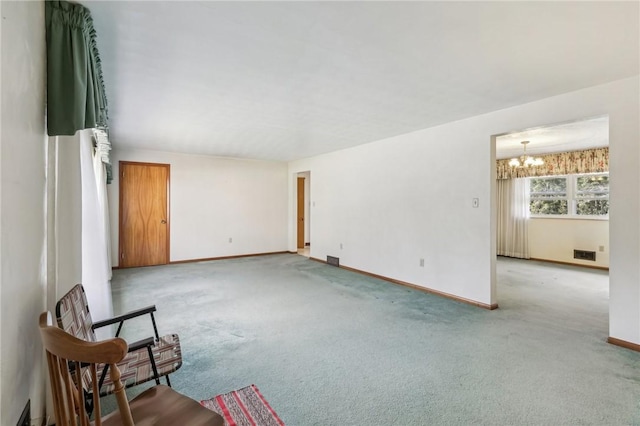 living room with visible vents, light carpet, baseboards, and a chandelier