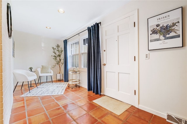 tiled foyer entrance featuring recessed lighting, visible vents, and baseboards