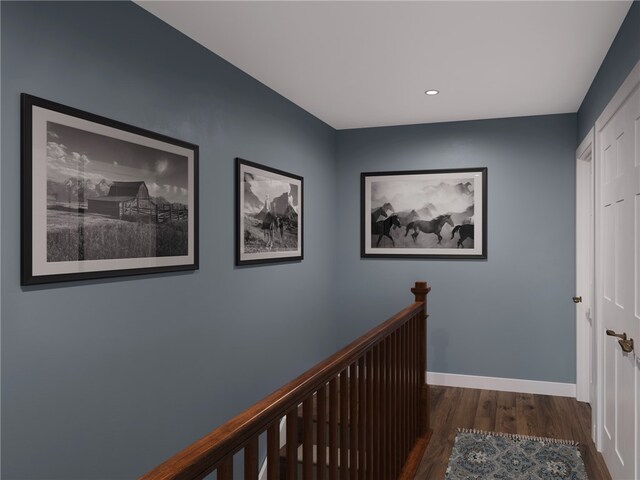 corridor with wood finished floors, recessed lighting, an upstairs landing, and baseboards