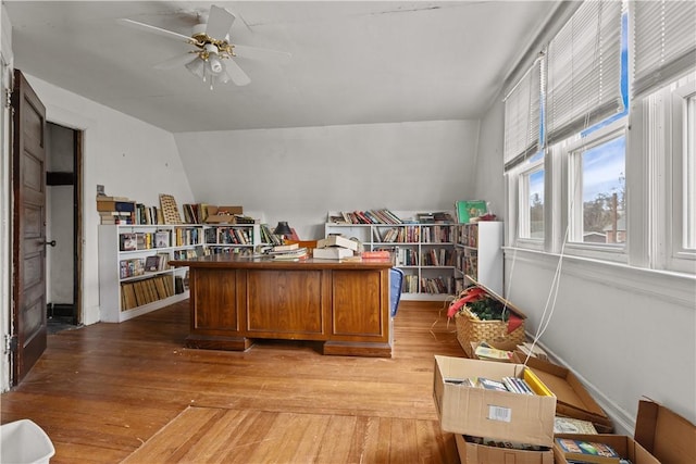 office space featuring light wood-style flooring, baseboards, and a ceiling fan