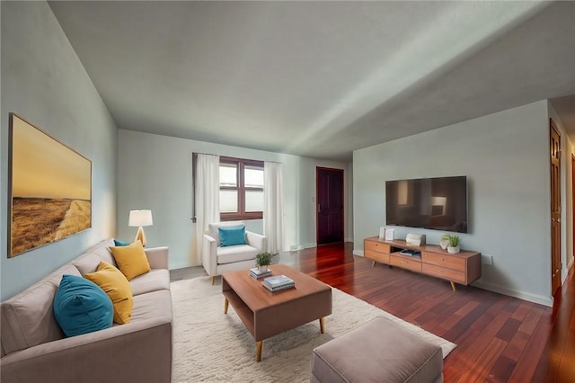 living room with wood finished floors and baseboards