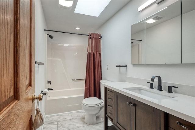 full bath with toilet, marble finish floor, a skylight, shower / tub combo, and vanity