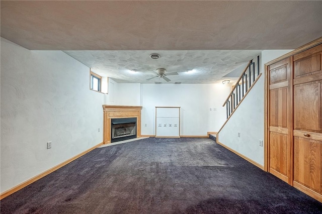 below grade area with carpet, stairway, a fireplace, and baseboards