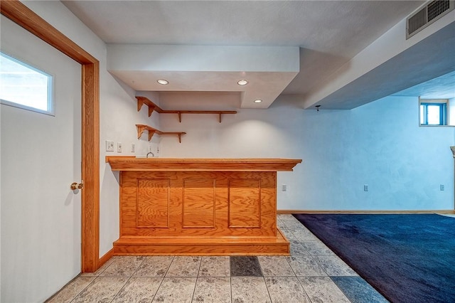 bar featuring visible vents, recessed lighting, baseboards, and indoor bar