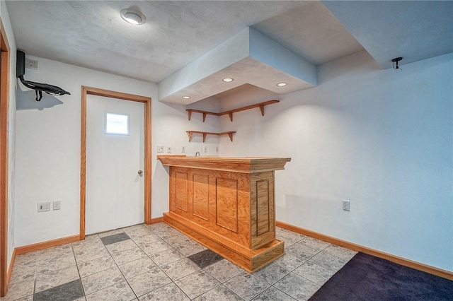 bar featuring wet bar, recessed lighting, and baseboards