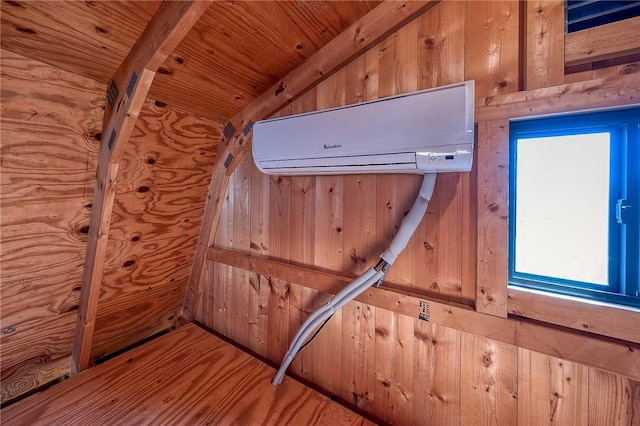 details with wood finished floors, wooden ceiling, wood walls, and a wall mounted AC