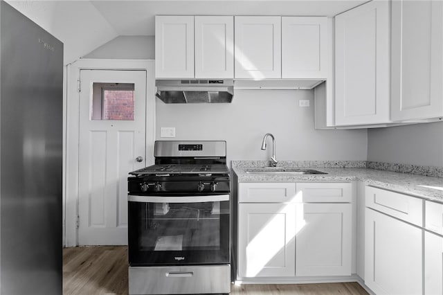 47 Bellanca Ave, Brentwood, PA 15227 - kitchen featuring under cabinet range hood, appliances with stainless steel finishes, white cabinetry, and a sink