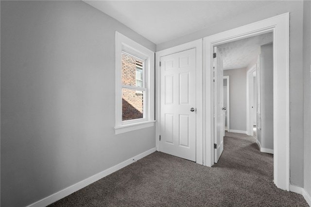 47 Bellanca Ave, Brentwood, PA 15227 - hallway featuring dark colored carpet and baseboards
