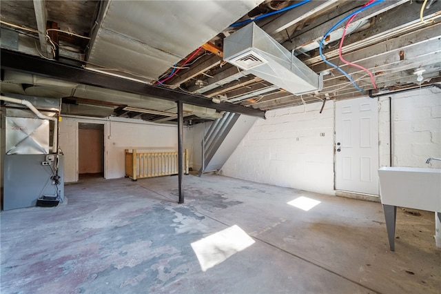 47 Bellanca Ave, Brentwood, PA 15227 - unfinished basement featuring concrete block wall, heating unit, and a sink