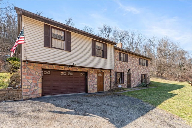 view of front of home featuring aphalt driveway, stone siding, a garage, and a front yard