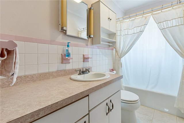 bathroom featuring tile patterned floors, toilet, shower / bath combo, crown molding, and vanity