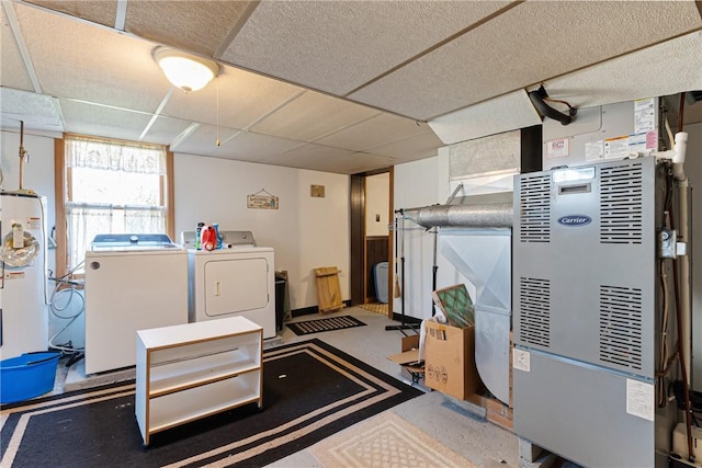 basement featuring separate washer and dryer and a paneled ceiling