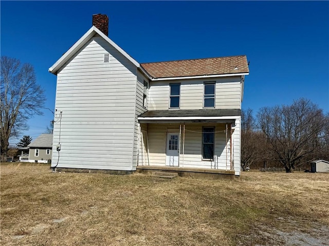 view of front of home featuring a porch and a front yard