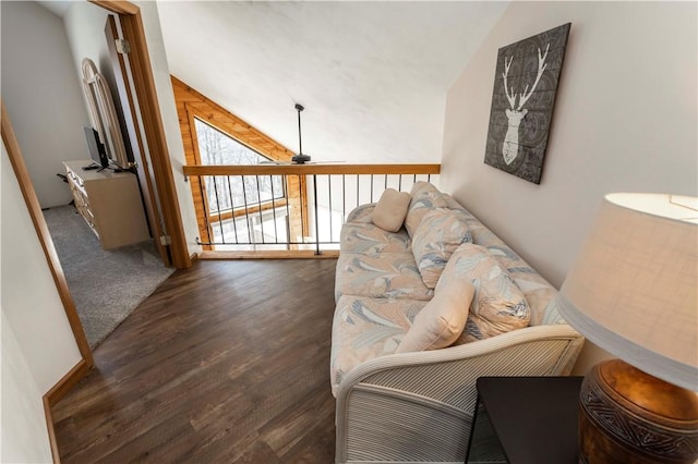 living room featuring wood finished floors, ceiling fan, and vaulted ceiling