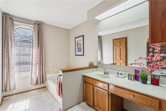 bathroom featuring tile patterned floors, a bath, and vanity