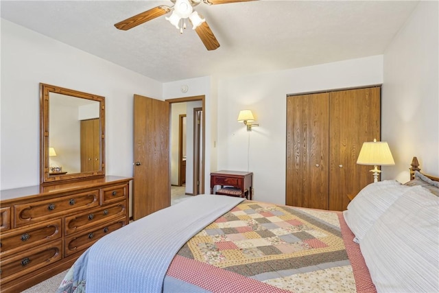 carpeted bedroom with a closet and ceiling fan