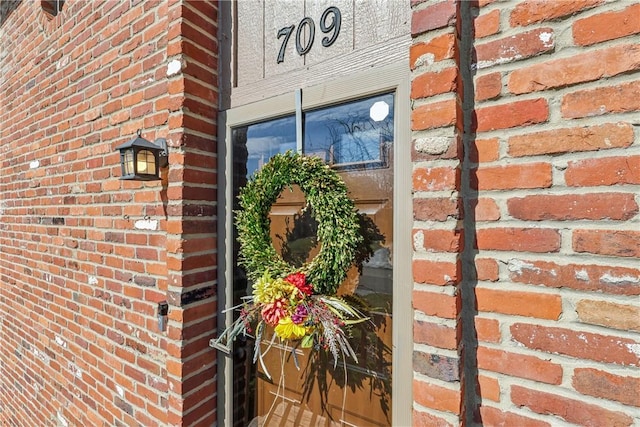 exterior details featuring brick siding