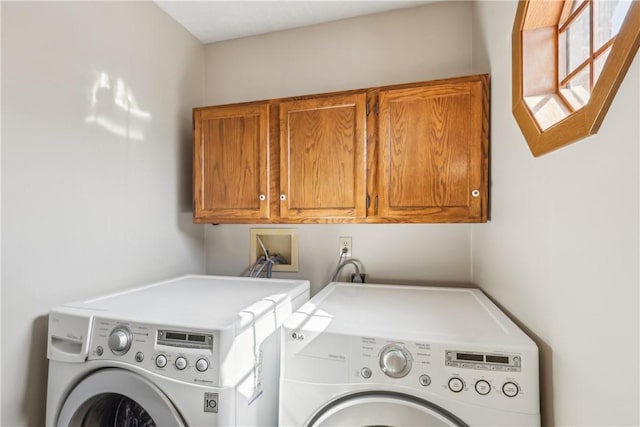 laundry room with washer and dryer and cabinet space