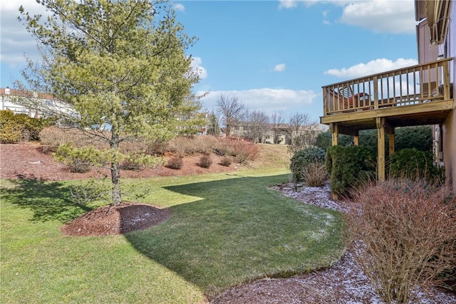 view of yard with a wooden deck