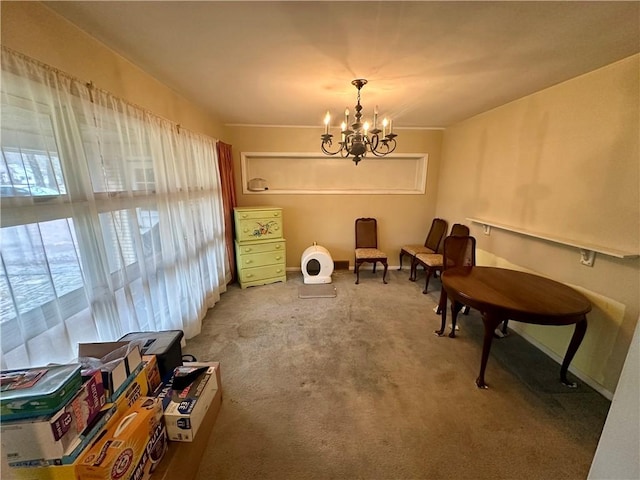 living area featuring a notable chandelier and carpet flooring