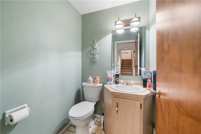 bathroom with toilet and vanity