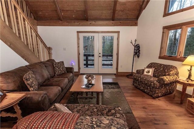 living room with wood finished floors, stairs, french doors, wooden ceiling, and beamed ceiling