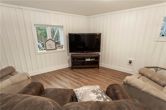 living room featuring baseboards and wood finished floors