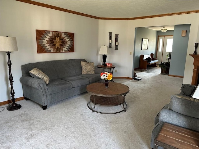 carpeted living area with baseboards and crown molding