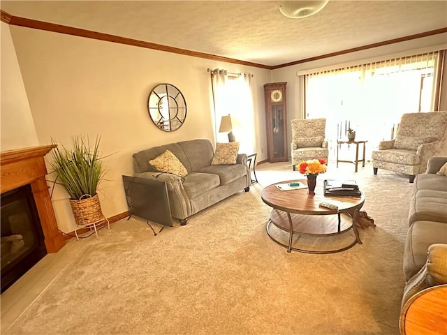 living area featuring a glass covered fireplace, crown molding, light carpet, and a textured ceiling