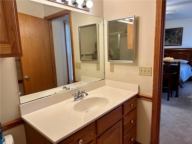 bathroom featuring vanity and ensuite bathroom