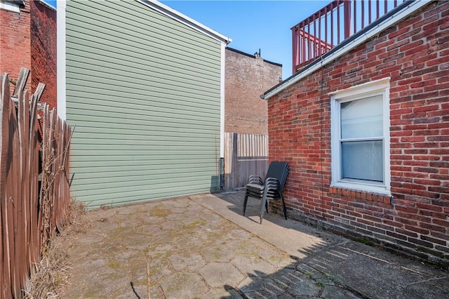 view of patio / terrace featuring fence