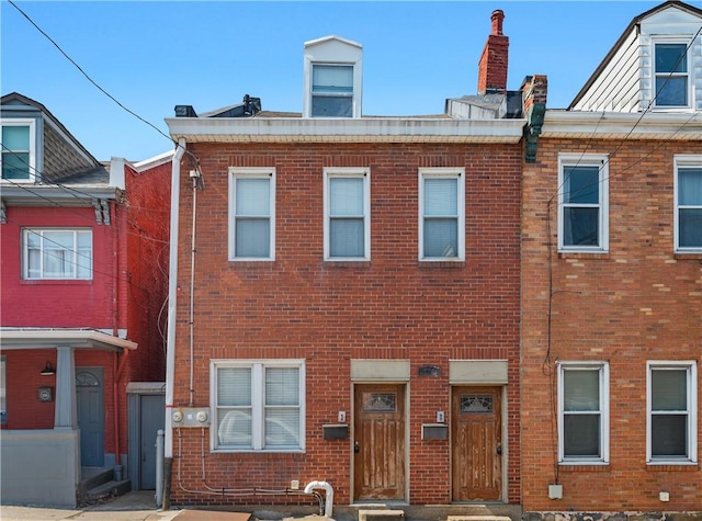 view of property featuring brick siding