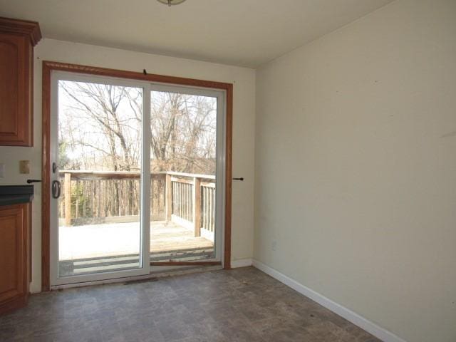 interior space featuring tile patterned floors and baseboards