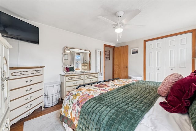 bedroom with a closet, ceiling fan, and wood finished floors