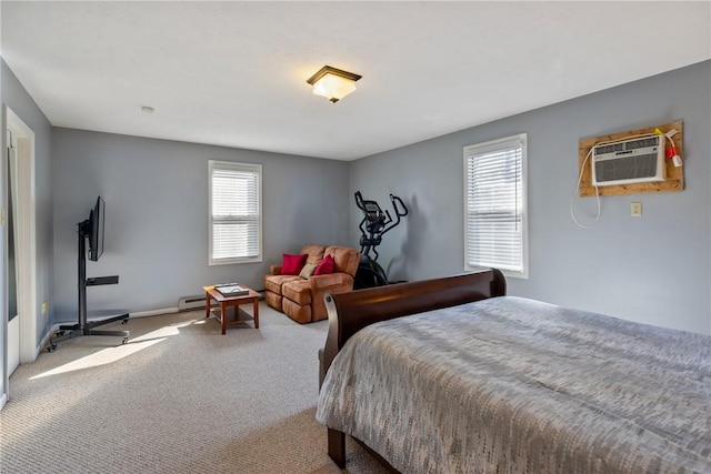 carpeted bedroom featuring a baseboard heating unit, baseboards, and a wall unit AC