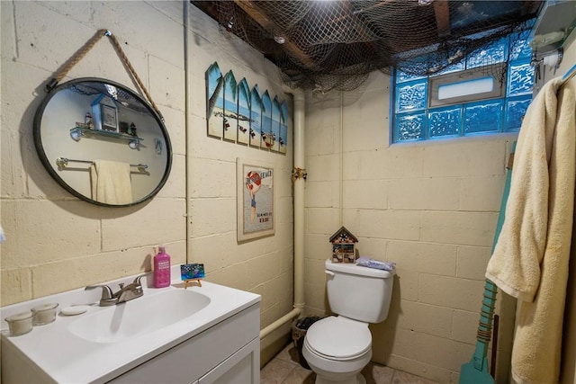 bathroom with toilet and vanity