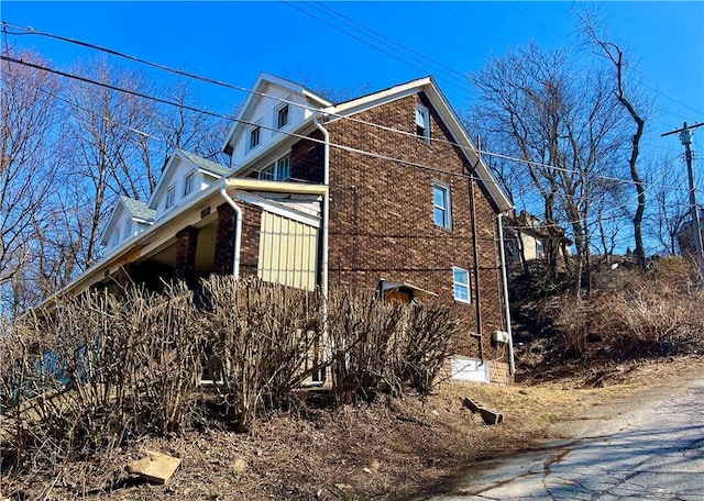 view of home's exterior featuring brick siding