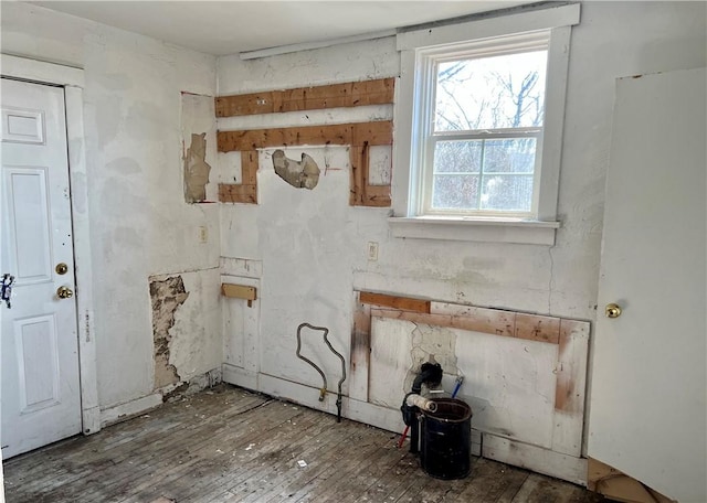 laundry room featuring wood-type flooring