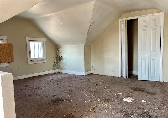 bonus room with vaulted ceiling