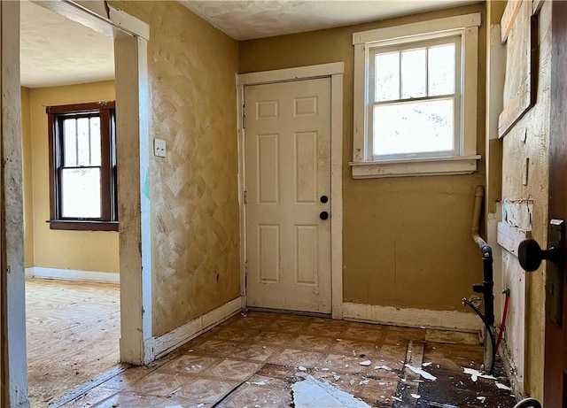 interior space featuring baseboards