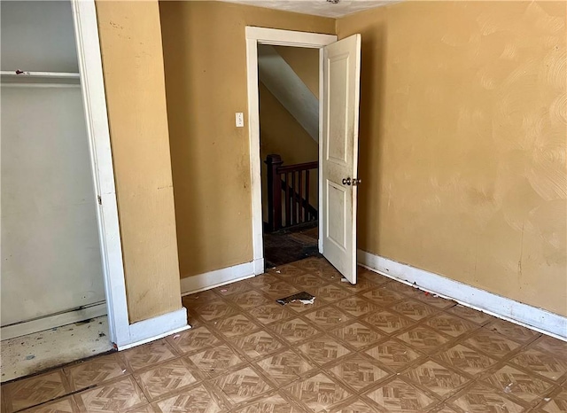 unfurnished bedroom featuring baseboards