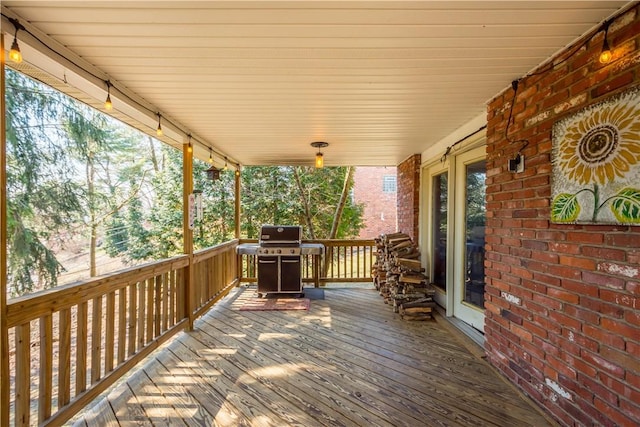 wooden terrace with grilling area