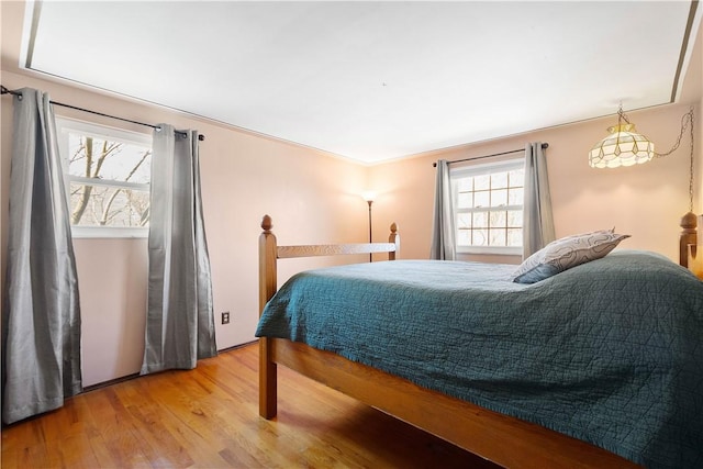 bedroom with light wood-type flooring