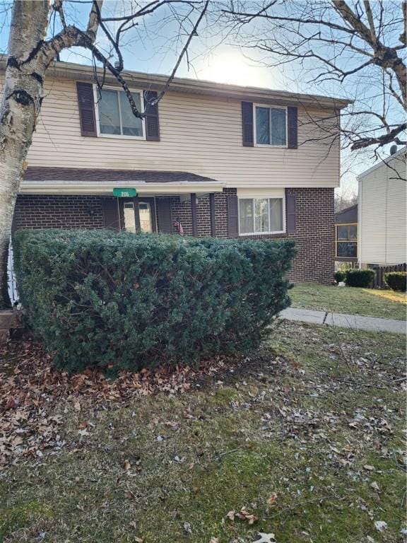 view of front of house with brick siding