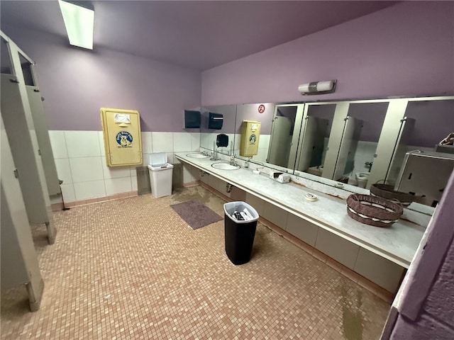 bathroom featuring toilet and lofted ceiling