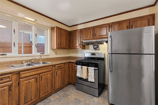 kitchen featuring a sink, brown cabinets, under cabinet range hood, and stainless steel appliances