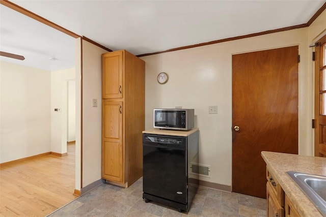 kitchen featuring visible vents, stainless steel microwave, crown molding, light countertops, and dishwasher