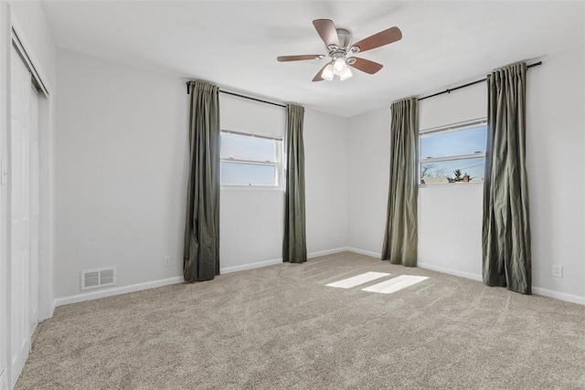 unfurnished bedroom with visible vents, ceiling fan, baseboards, and carpet floors