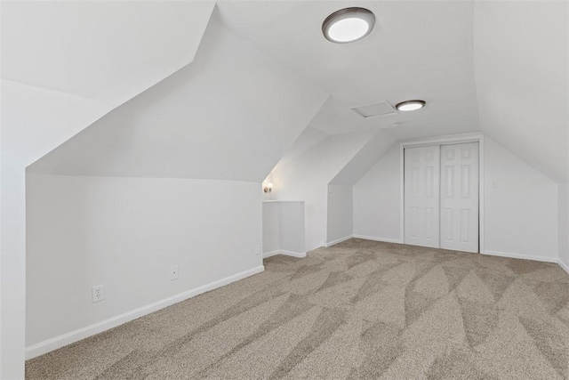 bonus room featuring baseboards, lofted ceiling, and carpet