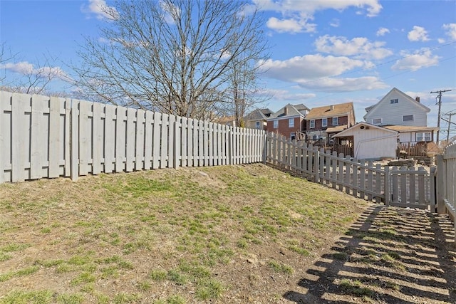 view of yard with a fenced backyard